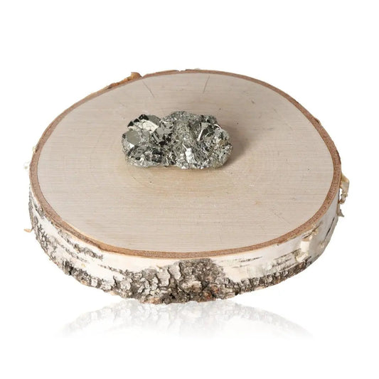Pyrite druze on a wooden slab, showcasing its metallic luster and golden hue, symbolizing abundance and prosperity.