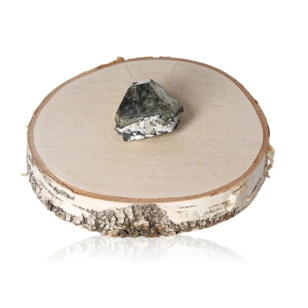 Pyrite druze crystal on a wooden base showcasing its shiny, metallic luster and striking resemblance to gold.