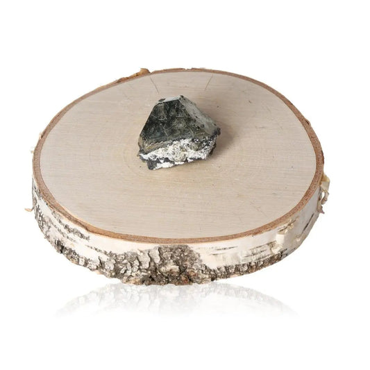 Pyrite druze crystal on a wooden base showcasing its shiny, metallic luster and striking resemblance to gold.