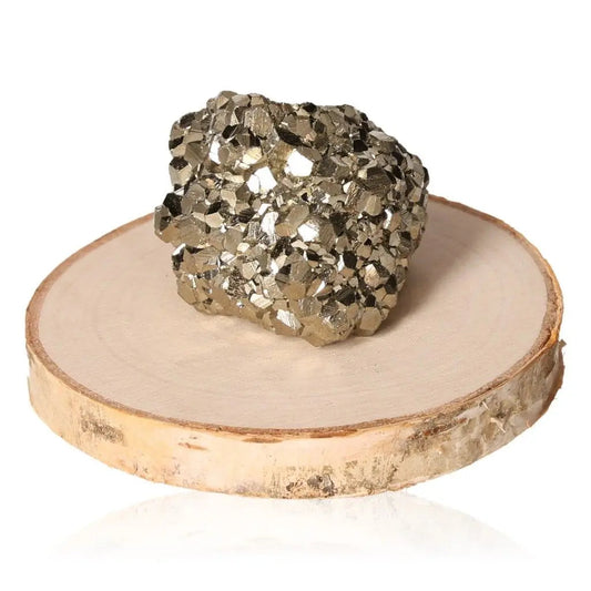 Pyrite druzy stone displaying metallic luster on a wooden base, symbolizing abundance and prosperity.