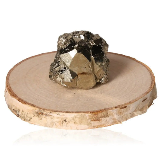 Pyrite druze on wooden slice, showcasing gold-like metallic luster, symbolizing abundance and prosperity.