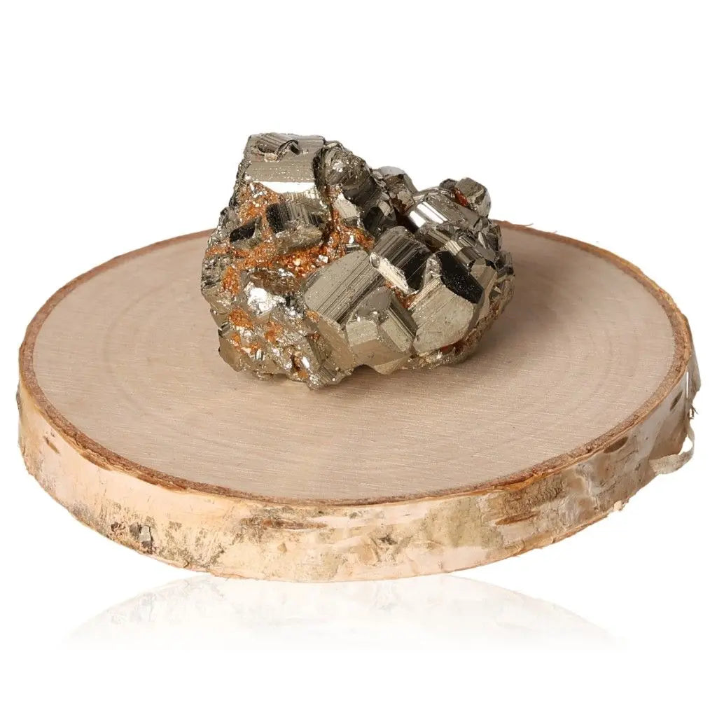 Shimmering pyrite gemstone on wooden stand, showcasing its golden hue and metallic luster, symbolizing abundance and prosperity.