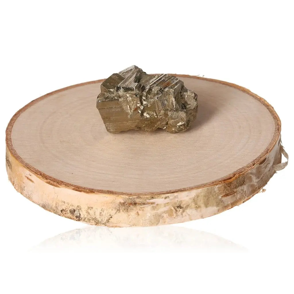 Pyrite druzy stone with metallic luster on a wooden stand, known as Fool's Gold, symbolizes prosperity and wealth.
