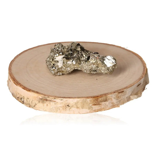 Pyrite druzy on wooden slice showcasing its golden hue and metallic luster, symbolizing abundance and prosperity.