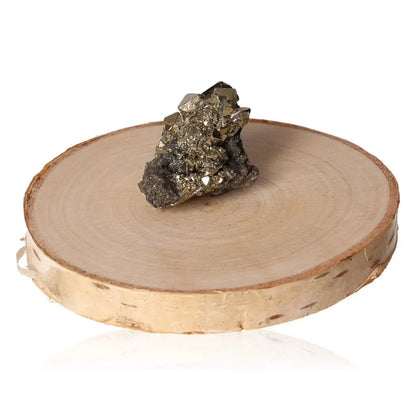 Pyrite druzy stone with metallic luster on wooden display, symbolizing wealth and prosperity.