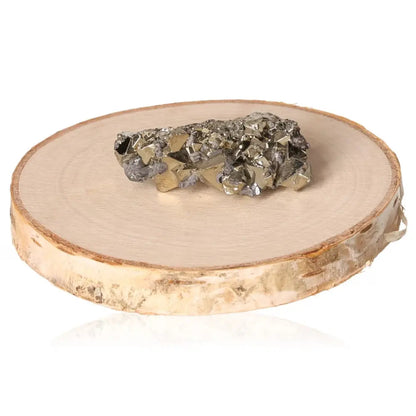 Pyrite druzy on wooden display, showcasing its golden hue and metallic luster, symbolizing prosperity and wealth.