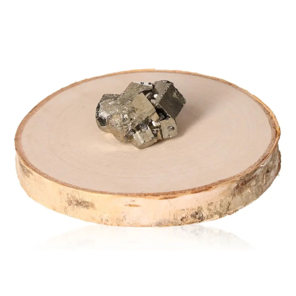 Natural pyrite druzy displayed on a wooden platform, showcasing its golden hue and metallic luster, symbolizing prosperity and abundance.