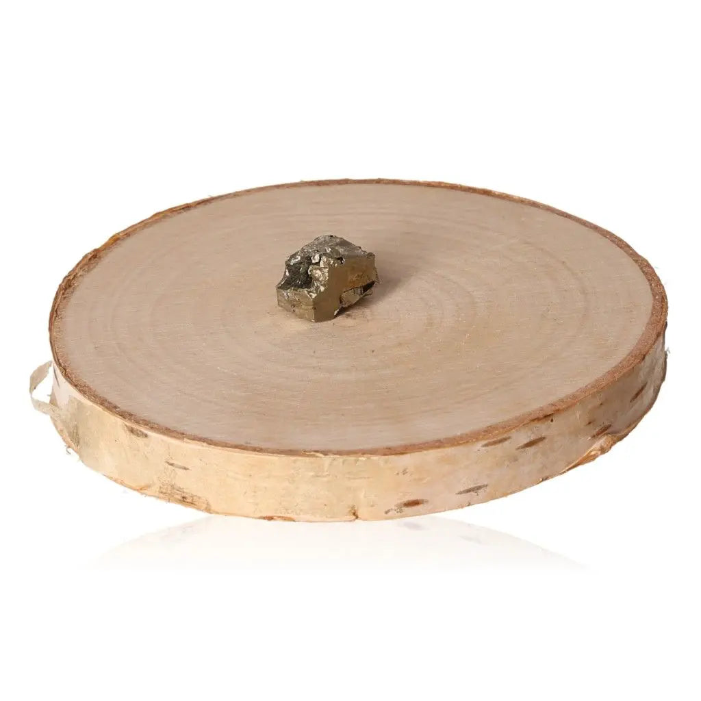 Pyrite druze on wooden slice, showcasing its golden hue and metallic luster, symbolizing abundance and prosperity.