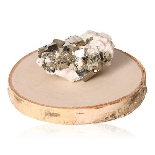Pyrite druze with metallic luster and golden hue on a wooden display, symbolizing abundance and prosperity.