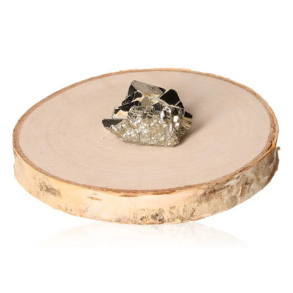 Pyrite druzy mineral with golden hue on wooden slice, symbolizing abundance and prosperity, often called Fool's Gold.
