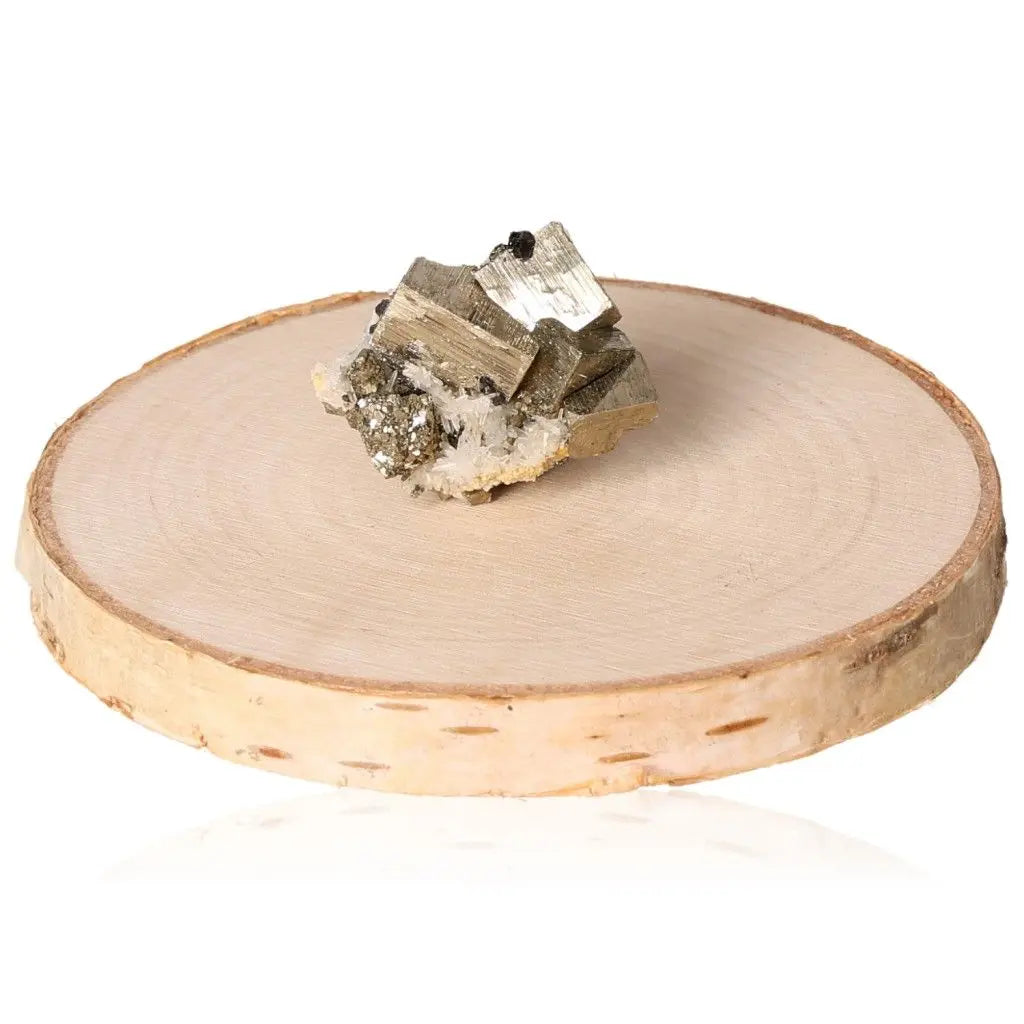 Pyrite druze crystal on wooden slab, known for its golden hue and metallic luster, symbolizing abundance and prosperity.