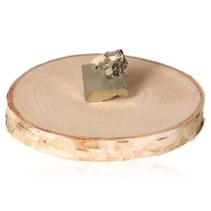 Golden pyrite druzy on a natural wood slice, showcasing its metallic luster and cubic crystal formations.