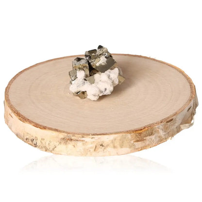 Pyrite druze on a wooden base showcasing its golden hue and metallic luster, symbolizing abundance and attracting prosperity.