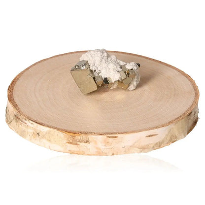 Pyrite druze with metallic luster on wooden display, symbolizing abundance and prosperity.