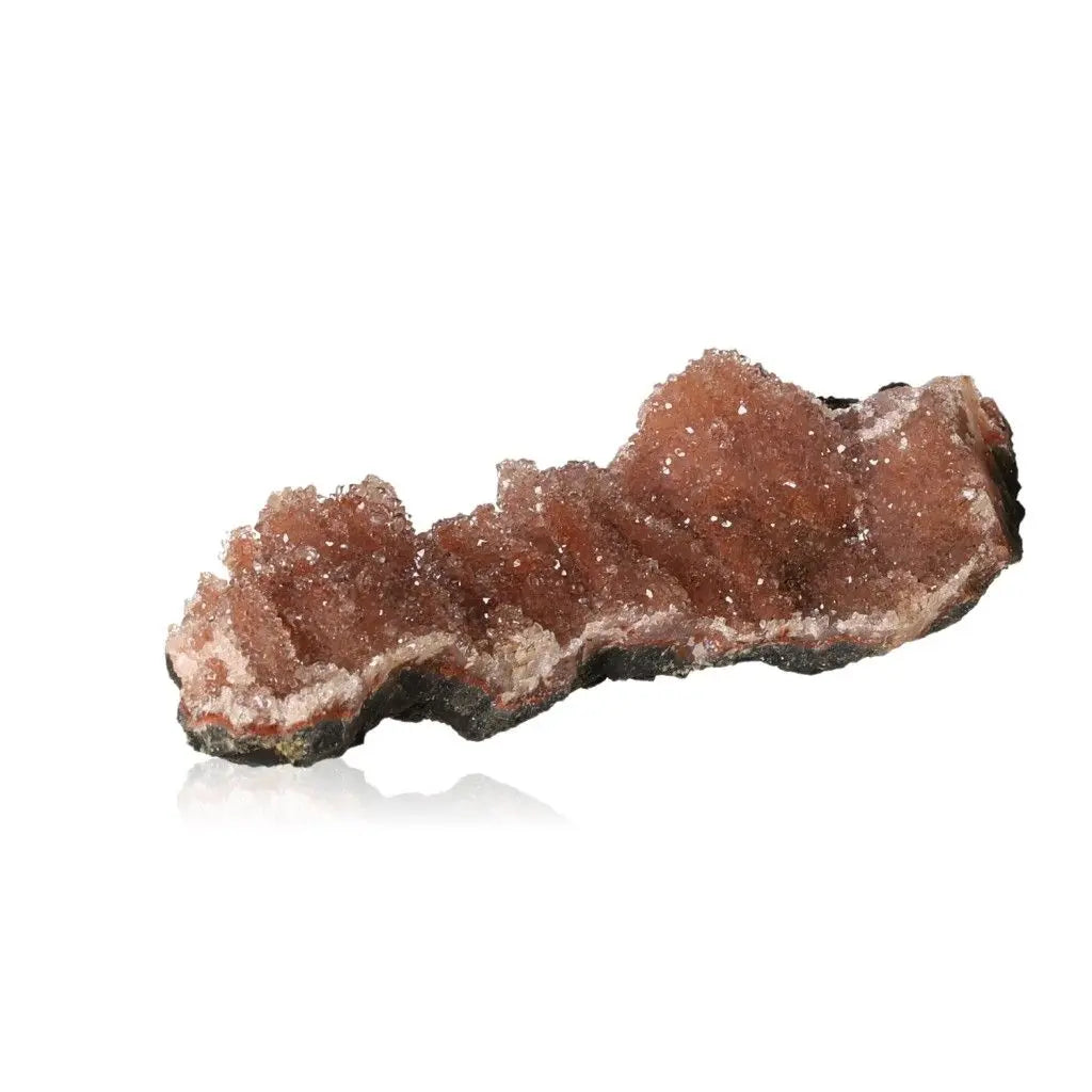 Rose Quartz Druze cluster with shimmering crystals, embodying the luxury and spirituality of Sylvia Crystals.
