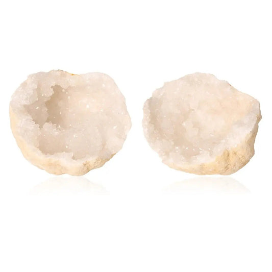 Quartz geode split open revealing cloudy white crystals, showcasing natural beauty and purifying energy; ideal for collectors.