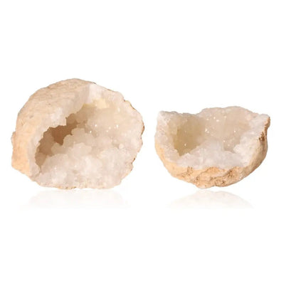 Quartz geode split open revealing sparkling cloudy white crystals inside, showcasing natural beauty and purifying energy potential.