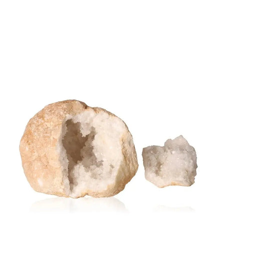 Quartz geode showcasing a rugged outer shell with sparkling white crystals inside, weighing between 700-900g.
