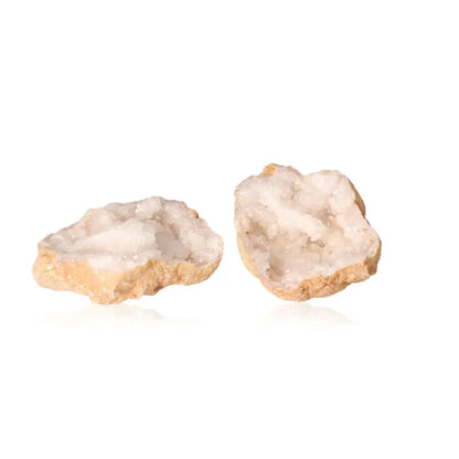 Quartz Geode split open revealing sparkling white crystals ideal for purifying and amplifying energy.
