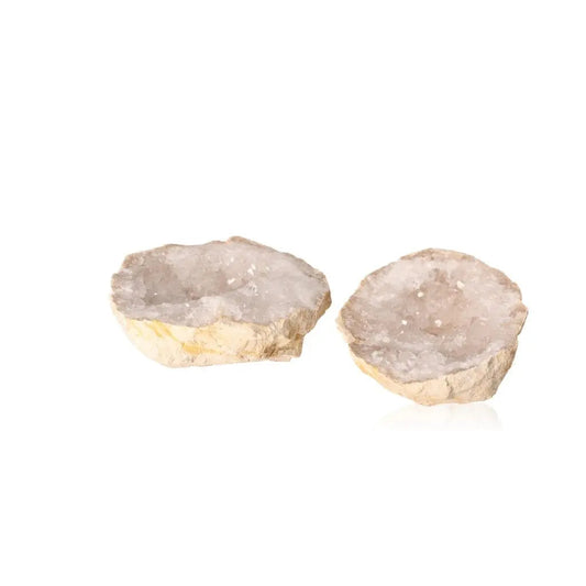 Rugged quartz geode halves revealing cloudy white crystals, showcasing nature's beauty and energy in earthy tones.