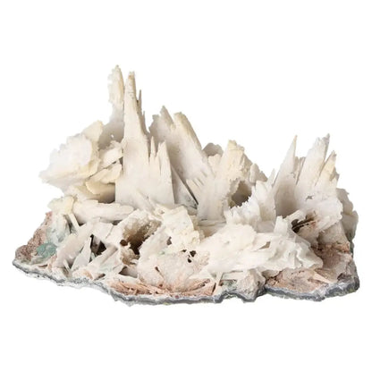 Quartz pseudomorph after zeolite mineral specimen showcasing rare crystal transformation from Sylvia Crystals, white quartz spikes.