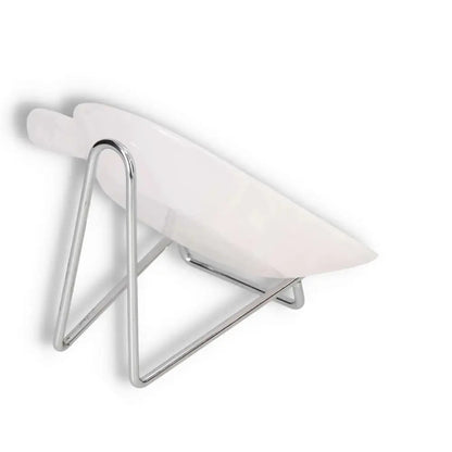 Stylish white bowl on sleek chrome stand, modern home decor