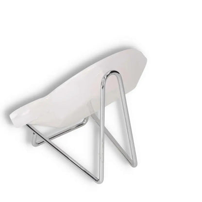 Modern white plate on a sleek silver stand, showcasing elegant design and minimalist style.