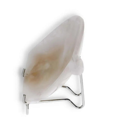 Side view of a rose onyx platter with natural veining and smooth finish, displayed on a metal stand.