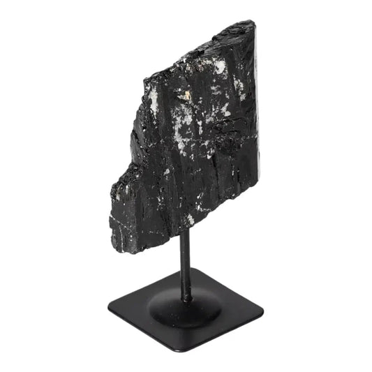 Rough Black Tourmaline on metal stand, premium natural healing crystal for cleansing and renewal, by Sylvia Crystals.