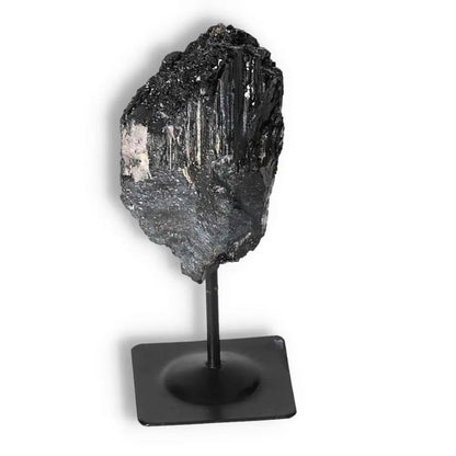 Rough Black Tourmaline with Metal Stand by Sylvia Crystals, showcasing luxury and spiritual balance for a harmonious environment. 