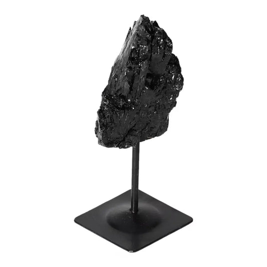 Rough Black Tourmaline on metal stand, a Sylvia Crystals product, known for cleansing negative energies. Elegant home or office decor.