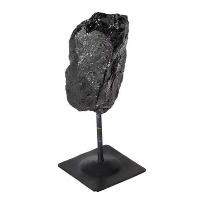 Rough Black Tourmaline with Metal Stand S, perfect for cleansing negative energy, offered by Sylvia Crystals, enhancing any space.