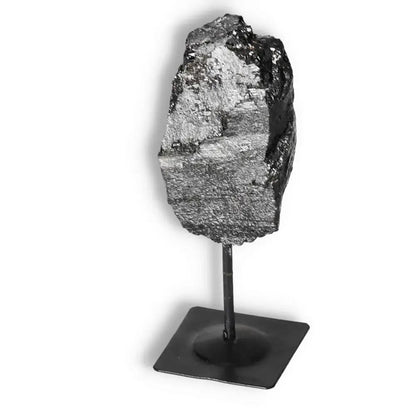 Rough Black Tourmaline with Metal Stand S from Sylvia Crystals, known for purifying energies and enhancing any environment.