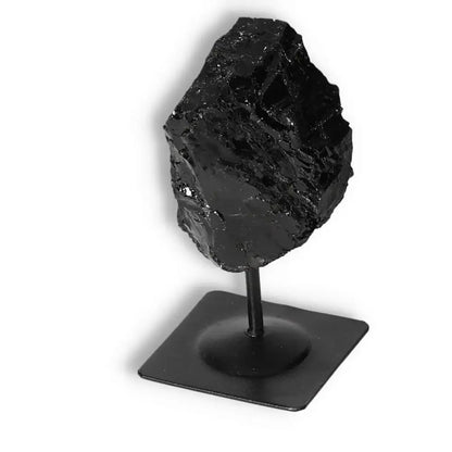 Rough Black Tourmaline on sleek metal stand showcasing elegance and cleansing energy from Sylvia Crystals