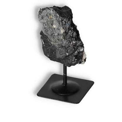 Rough Black Tourmaline on Metal Stand, renowned for cleansing properties, from Sylvia Crystals - high-quality and authentic.