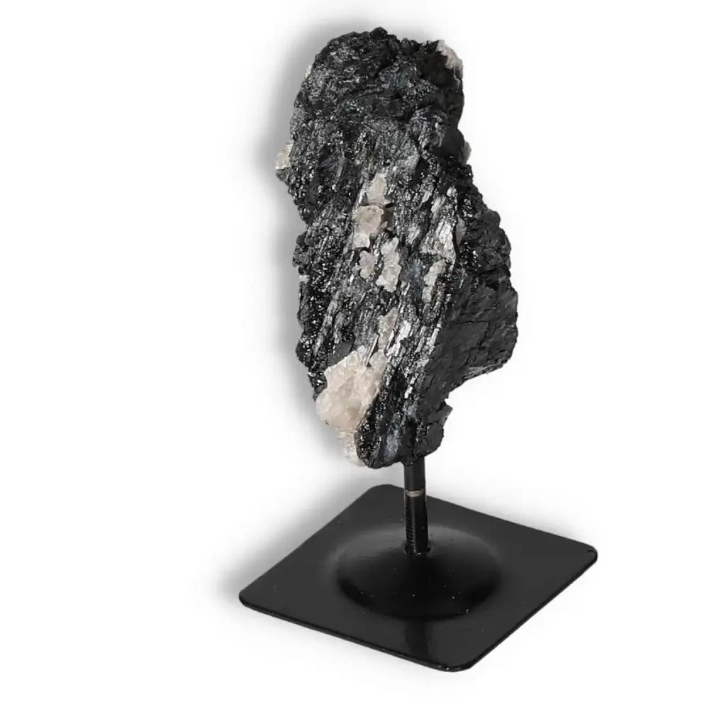 Rough Black Tourmaline with Metal Stand S from Sylvia Crystals, known for cleansing negative energies into positives.