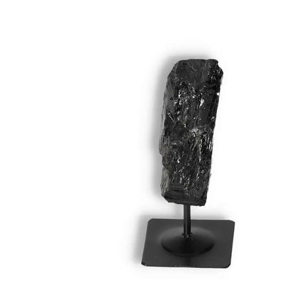 Rough Black Tourmaline on Metal Stand by Sylvia Crystals for spiritual wellbeing and energy cleansing.