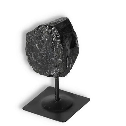 Rough Black Tourmaline on Metal Stand; luxury crystal for energy cleansing and grounding from Sylvia Crystals.