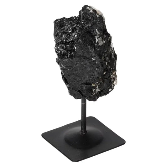 Rough Black Tourmaline on Metal Stand by Sylvia Crystals, known for transforming negative energies and enhancing emotional balance.