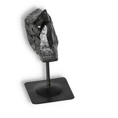 Rough Black Tourmaline with Metal Stand by Sylvia Crystals, perfect for home decor and spiritual enhancement.