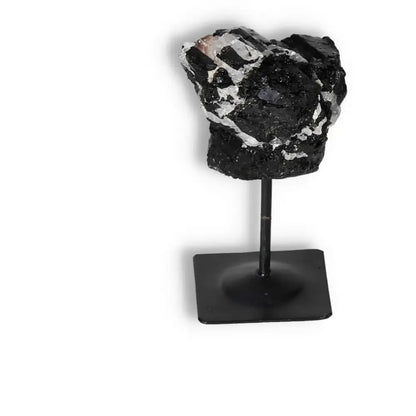 Rough Black Tourmaline on Metal Stand S from Sylvia Crystals, known for neutralizing negative energies, elegant crystal décor piece