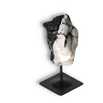 Rough Black Tourmaline crystal with metal stand, offering elegance and spiritual depth from Sylvia Crystals. Ideal for healing and grounding.