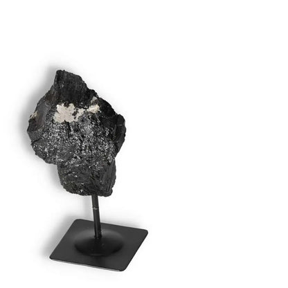Rough Black Tourmaline with Metal Stand by Sylvia Crystals, a natural gemstone for purifying and grounding, enhancing concentration.