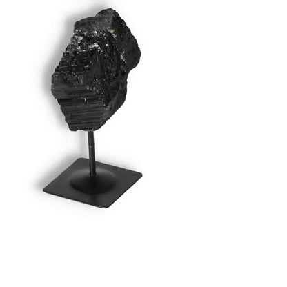 Rough Black Tourmaline with Metal Stand S by Sylvia Crystals, known for grounding and energy purification, showcased on a stand.