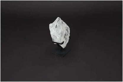 Rough Lemurian Quartz on metal stand, offering energy purification and harmonization, by Sylvia Crystals.