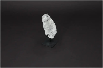 Rough Lemurian Quartz on metal stand, showcasing natural elegance and spiritual depth from Sylvia Crystals.