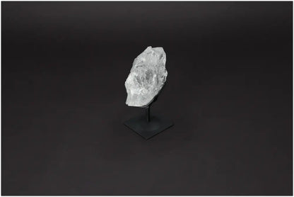 Rough Lemurian Quartz on metal stand, showcasing natural elegance and spiritual depth, by Sylvia Crystals.