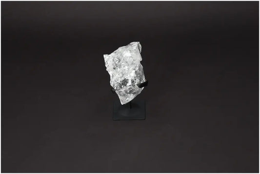 Rough Lemurian Quartz on metal stand, premium Sylvia Crystals product known for purification and harmonizing energy.