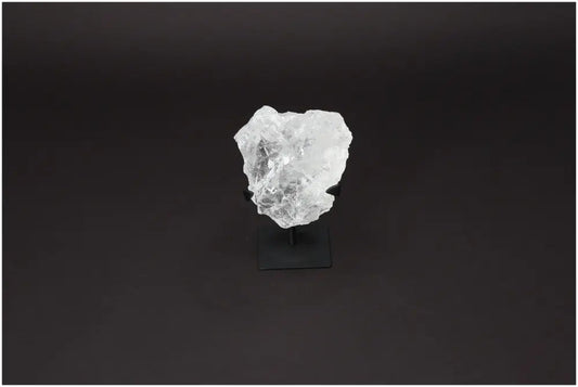 Rough Lemurian Quartz on metal stand, featuring clear crystal design, from Sylvia Crystals for purification and harmonious living.