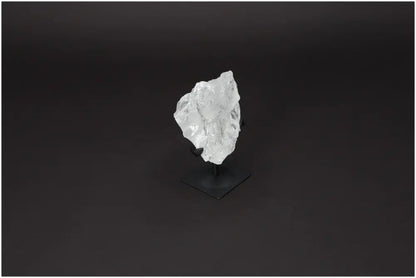 Rough Lemurian Quartz on Metal Stand by Sylvia Crystals, enhancing spaces with elegance and purity, ideal for conscious living.